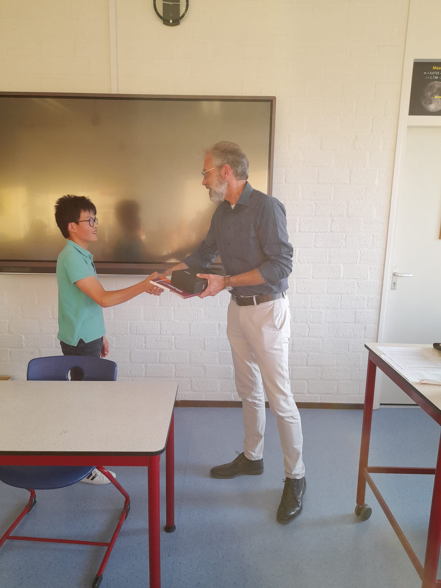 Foto student op diplomauitreiking